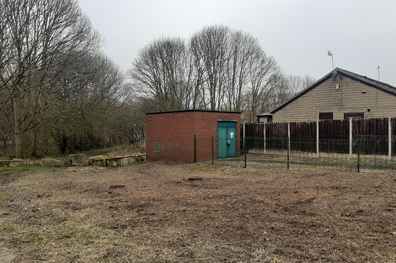 Neat and tidy green space in front of a building