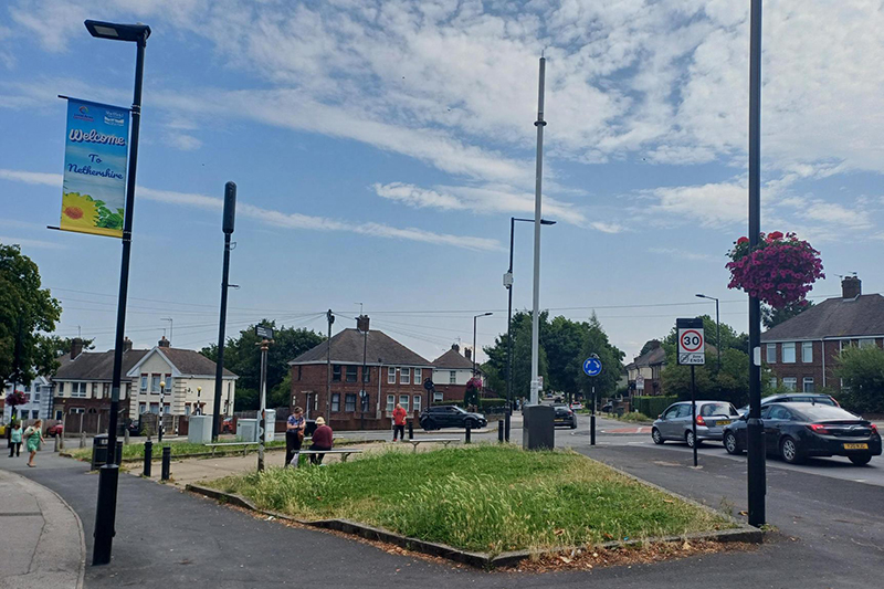 Street scene showing banners and planters