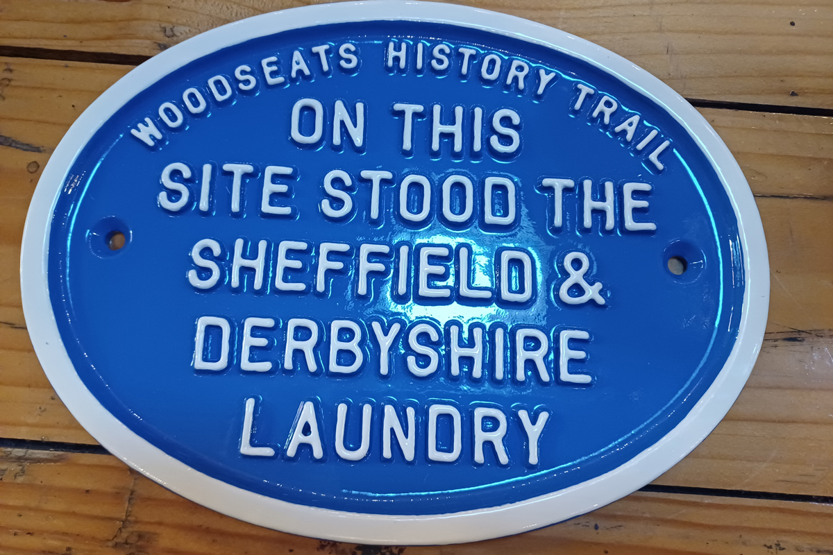 Blue plaque that reads 'Woodseats History Trail: on this site stood the Sheffield and Derbyshire Laundry