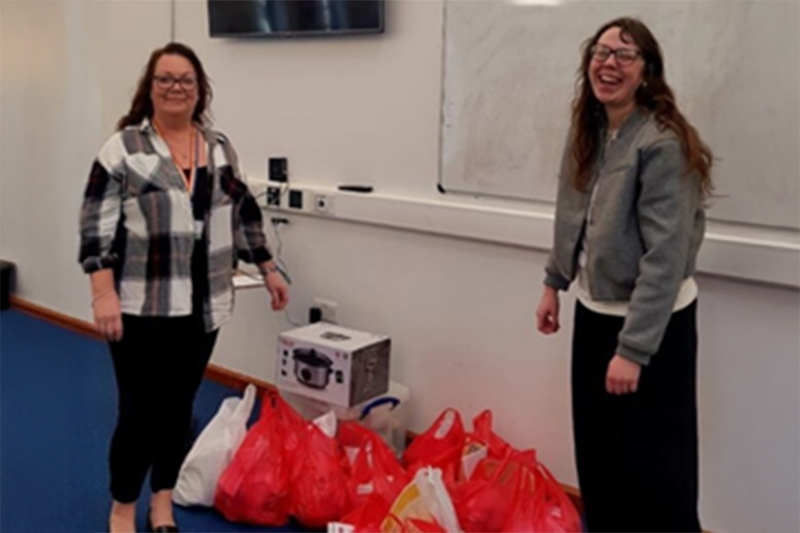 Two people with shopping bags